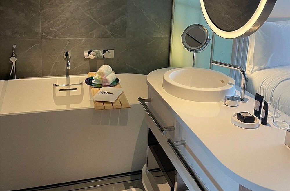 white basin cabinet led make up mirrors and freestanding bathtub
