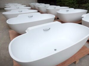 White bathtub with built-in grab bars